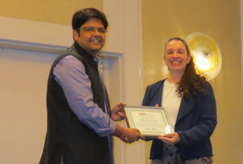 Mr. Rahul Choubey, Manager (Technology Development) with U. S. Department of Energy Assistant Secretary Patricia Hoffman, accepting the NASPI Award for Outstanding Utility of the Year on behalf of Power Grid Corporation of India, Ltd., on October 19, 2016 at the NASPI Work Group meeting in Seattle, Washington.